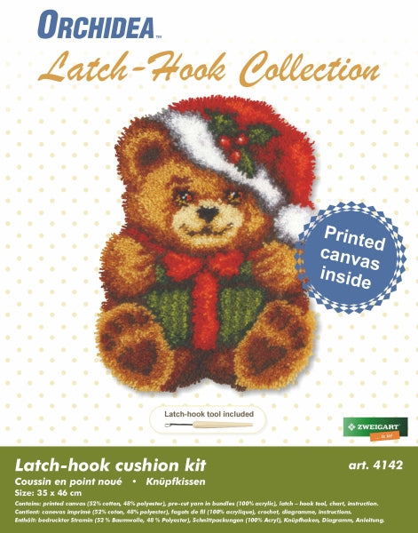 Latch hook cushion kit featuring a Christmas teddy bear design with vibrant yarn colors and printed canvas.